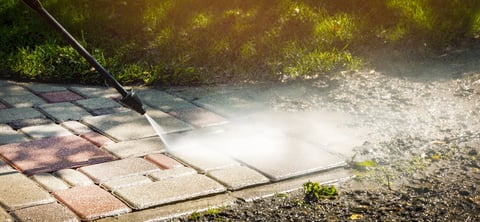 Dirty block pavement cleaning with high pressure washer